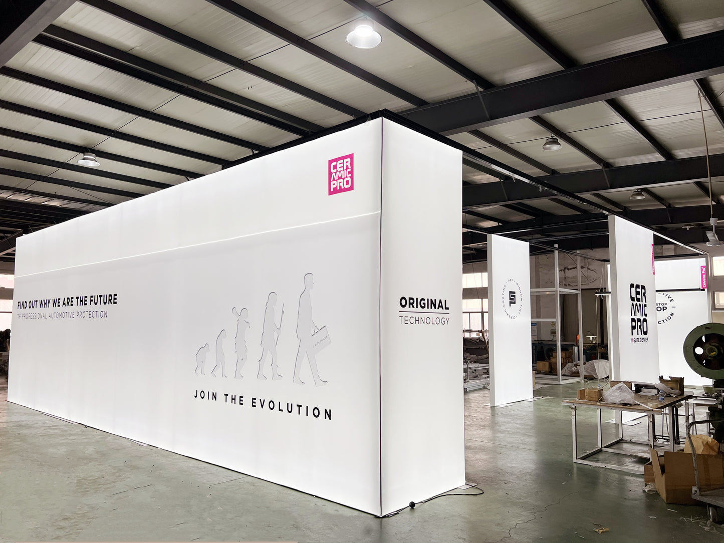 Custom Trade Show Booth Designs with Interactive LED Displays and Automotive Showpieces