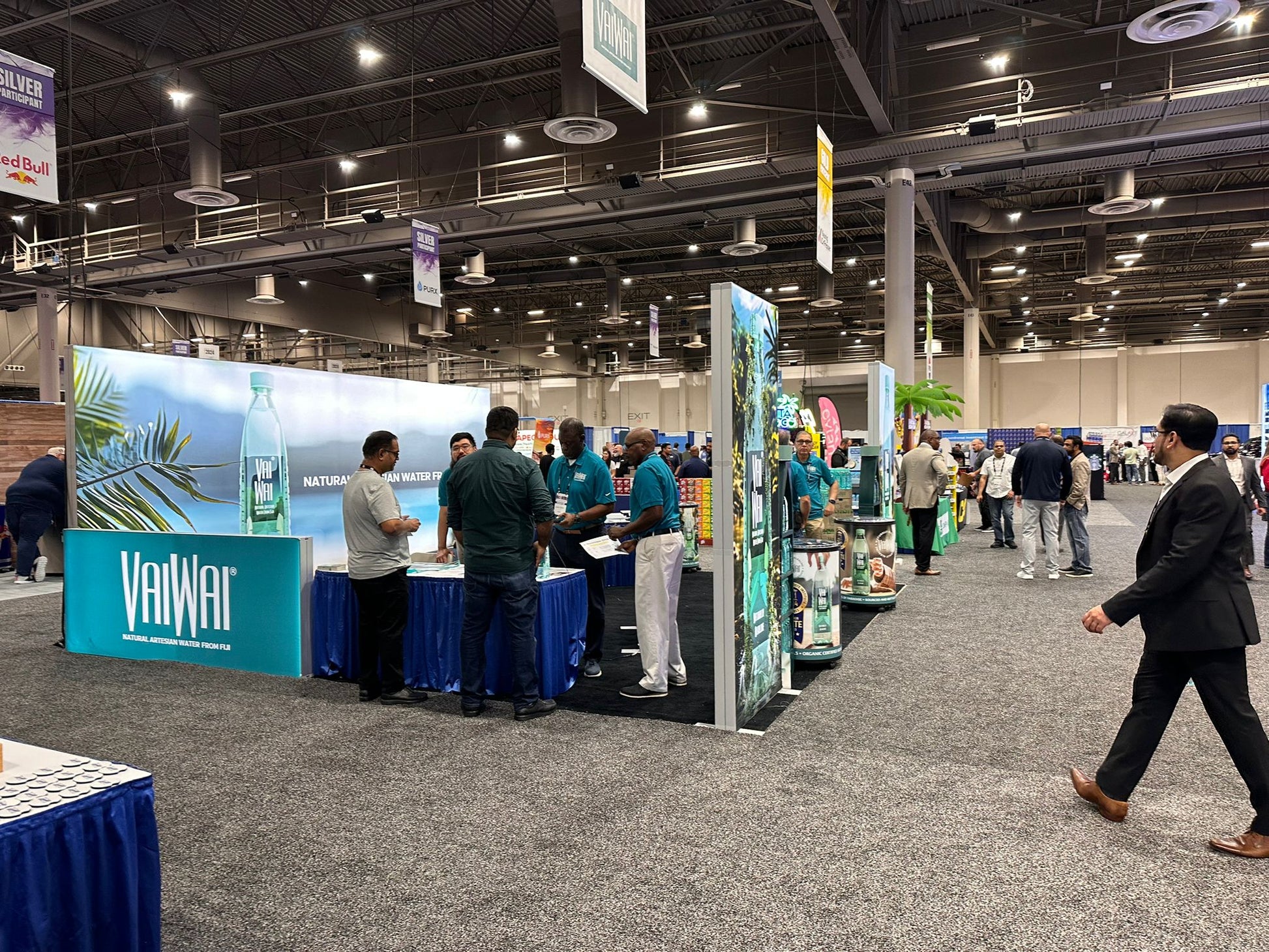 20x20 Custom Backlit Design Booth with SEG Walls, Illuminated Arch, and Modular Display Counter