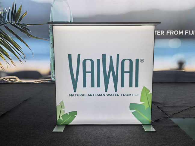 20x20 Custom Backlit Design Booth with SEG Walls, Illuminated Arch, and Modular Display Counter