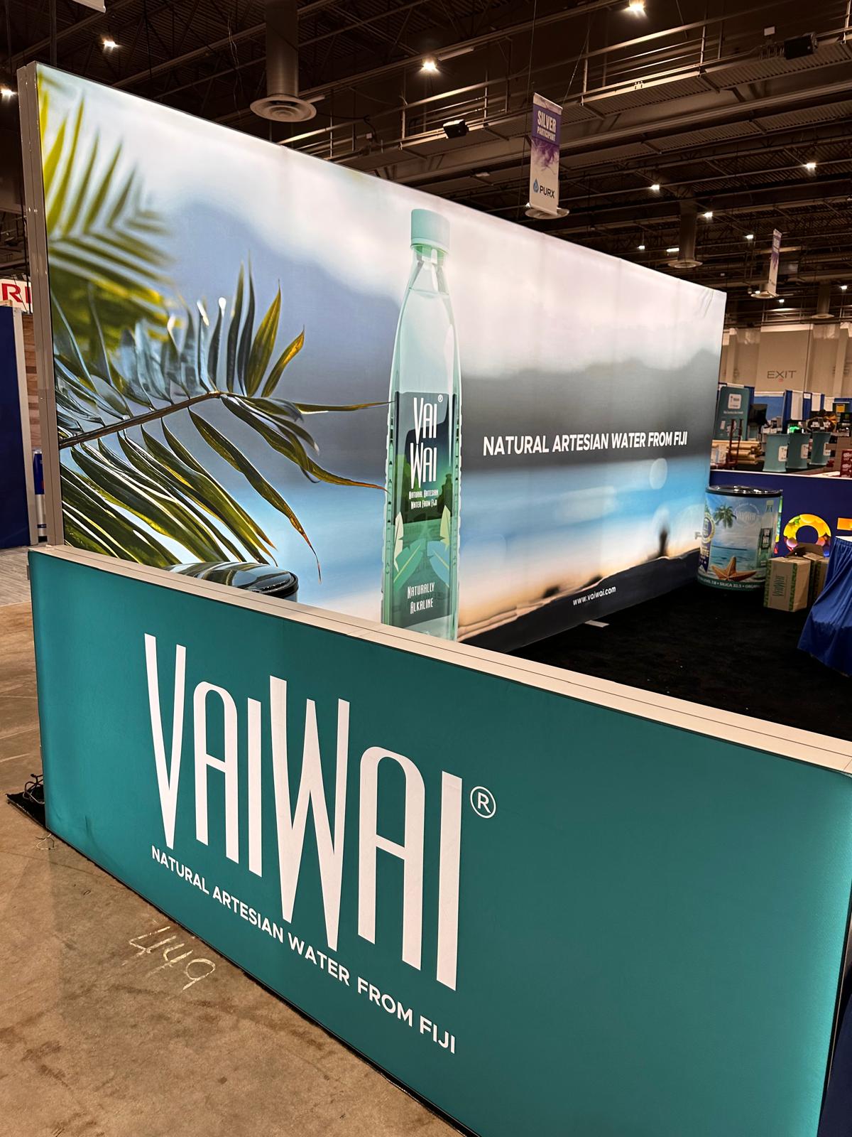 20x20 Custom Backlit Design Booth with SEG Walls, Illuminated Arch, and Modular Display Counter