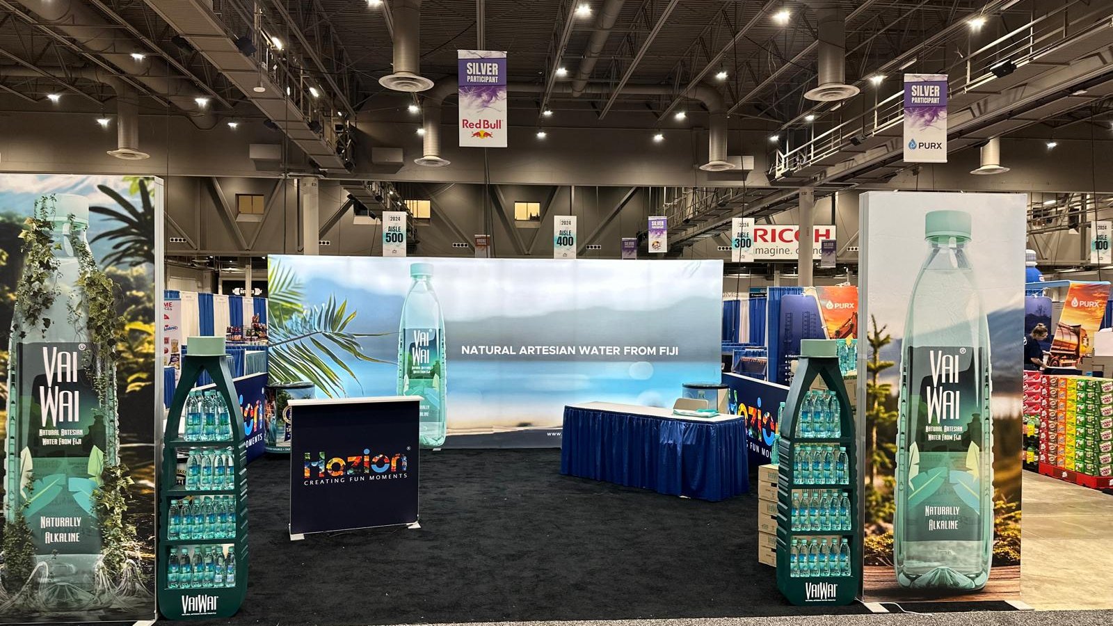 20x20 Custom Backlit Design Booth with SEG Walls, Illuminated Arch, and Modular Display Counter
