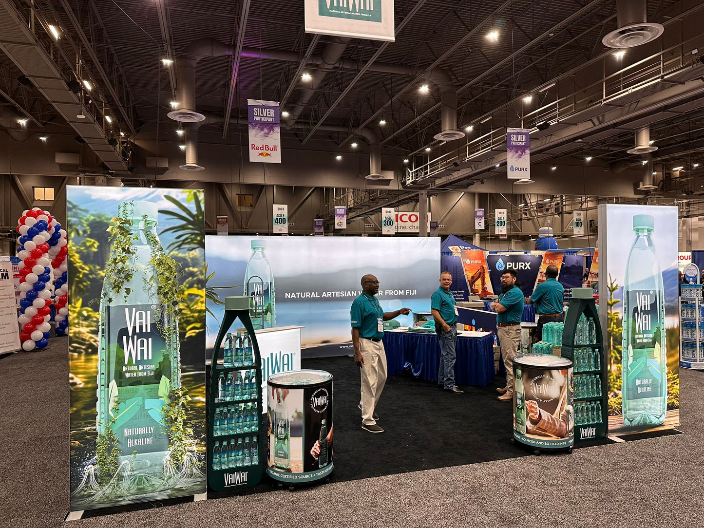 20x20 Custom Backlit Design Booth with SEG Walls, Illuminated Arch, and Modular Display Counter