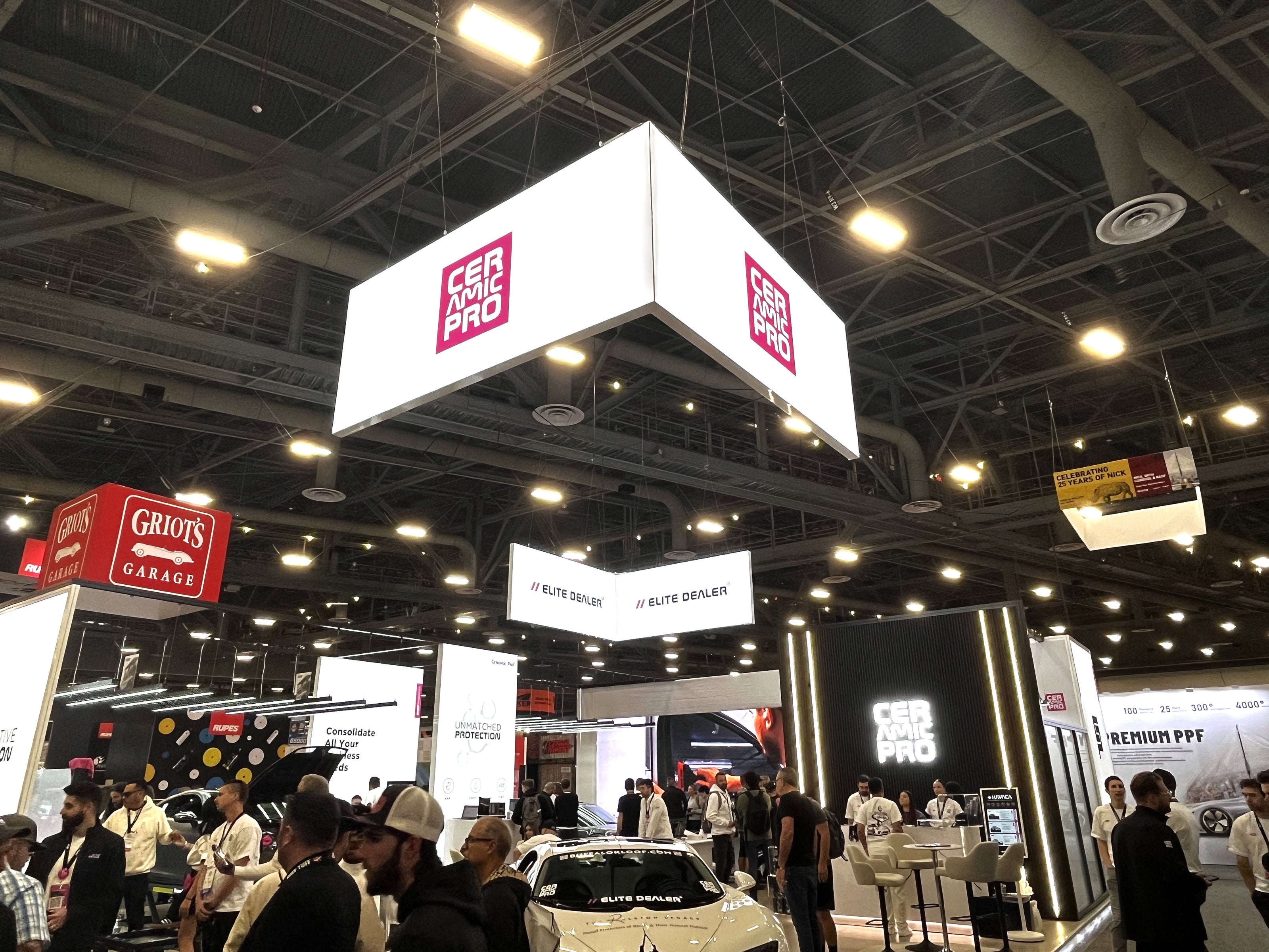 Custom Trade Show Booth Designs with Interactive LED Displays and Automotive Showpieces